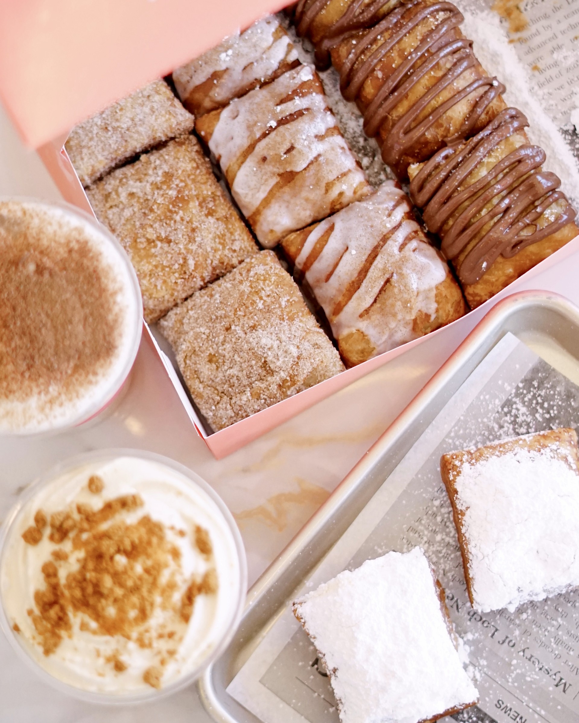 a tray of pastries and drinks